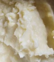 Kartupeļu biezenis ar sviestu un olas dzeltenumu