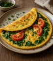 Omlete ar spinātiem, tomātiem un sieru