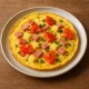 Omlete ar sieru, šķiņķi un dārzeņiem